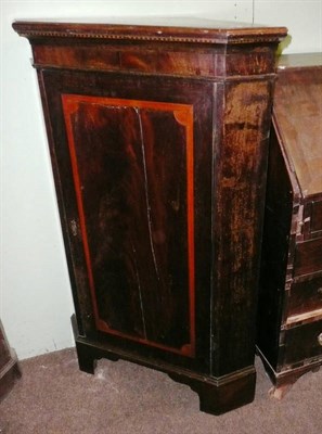 Lot 677 - A Georgian and later corner cupboard