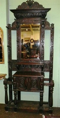 Lot 682 - A carved oak hall stand