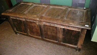 Lot 685 - An 18th century panelled oak coffer with carved frieze