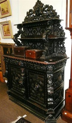 Lot 692 - Victorian carved oak cabinet with superstructure shelves above