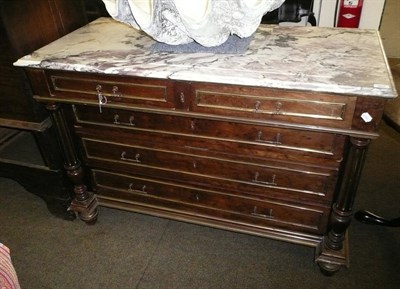 Lot 697 - An Empire-style four height chest with brass mounts and marble top