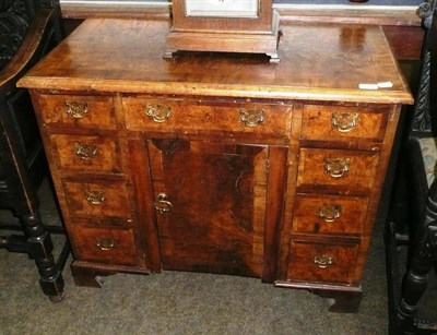 Lot 702 - A walnut kneehole desk