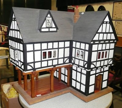 Lot 714 - A modern timber framed dolls house with oak panelling to the hall way