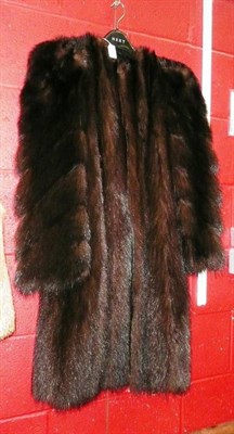 Lot 756 - A fur coat with chevron striped arms