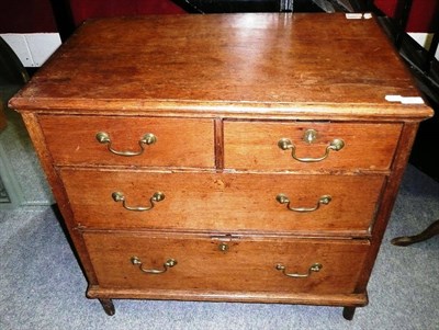 Lot 761 - A small Georgian oak three height chest of drawers