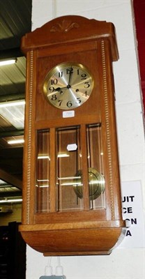 Lot 789 - An oak cased wall clock