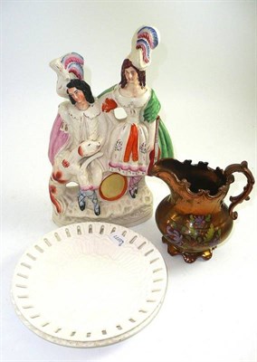 Lot 44 - Staffordshire figural group, a copper lustre jug and two Continental creamware plates