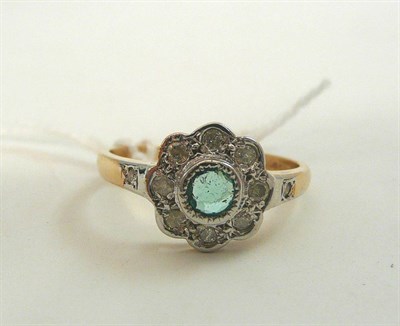 Lot 90 - A 9ct gold emerald and diamond cluster ring