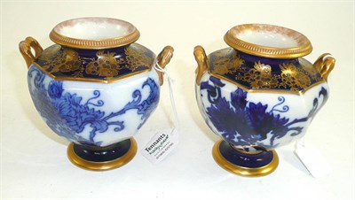 Lot 127 - A matched pair of James MacIntyre twin handled vases