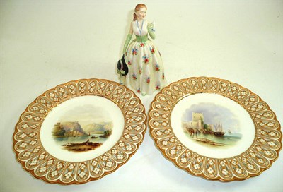 Lot 128 - A pair of English porcelain cabinet plates decorated with landscapes and a Doulton figure, Carolyn