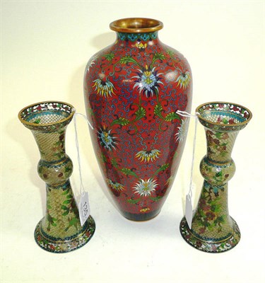 Lot 135 - A cloisonné vase and a pair of plique-à-jour candlesticks