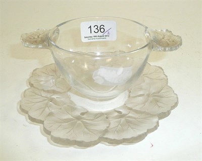Lot 136 - A Lalique clear glass two handled bowl and stand moulded with pansies