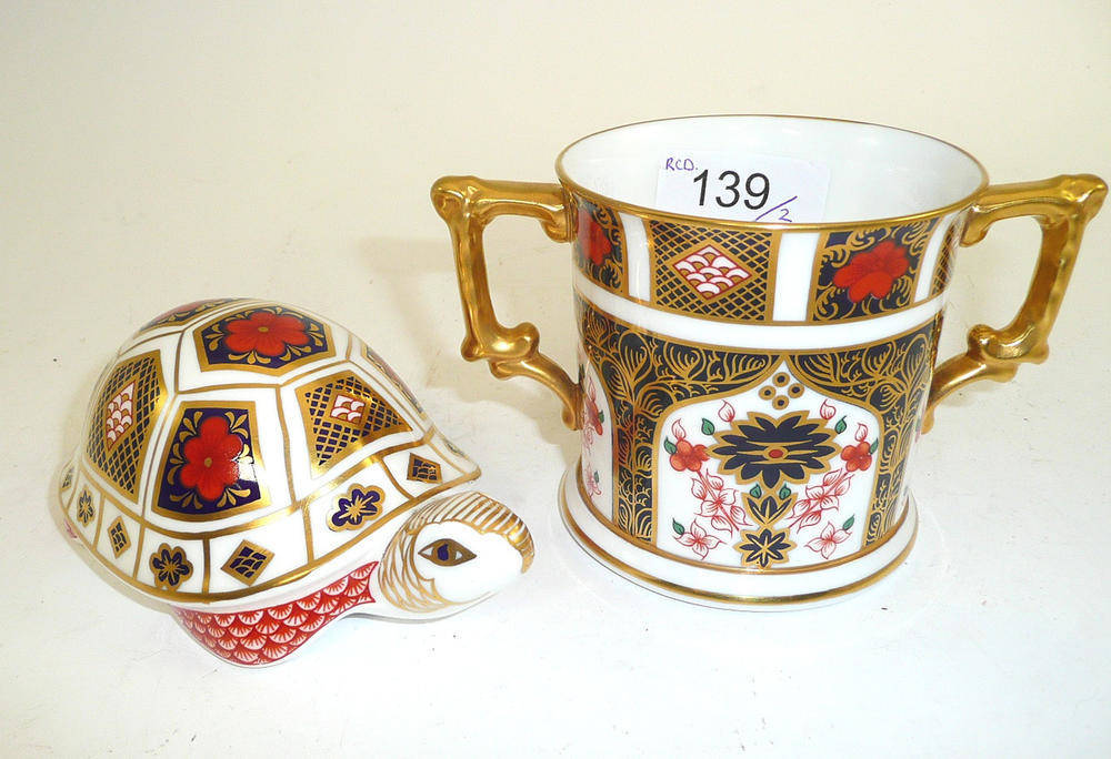 Lot 139 - Royal Crown Derby 1128 twin-handled mug and a Royal Crown Derby tortoise paperweight (2)