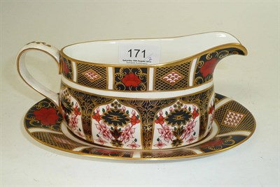 Lot 171 - Royal Crown Derby 1128 gravy boat on stand
