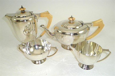 Lot 180 - A silver four piece tea set