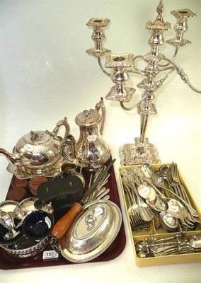 Lot 182 - A tray of silver plated items including tea set, condiments, flatwares and a four branch candelabra