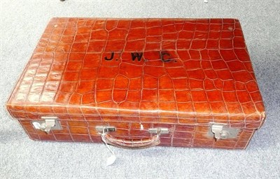 Lot 200 - A crocodile skin suitcase