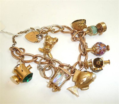 Lot 204 - 9ct charm bracelet with nine charms