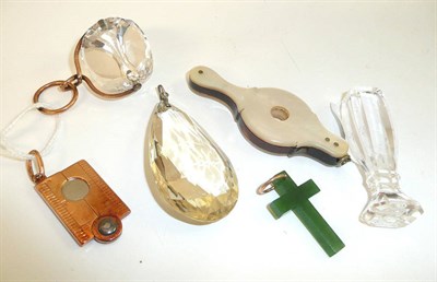 Lot 205 - A magnifying glass, a cigar cutter, a seal, two fobs and a jade cross