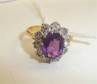 Lot 212 - An 18ct gold amethyst and diamond cluster ring