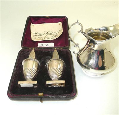 Lot 218 - Victorian silver cream jug and pair of silver pepperettes