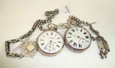 Lot 221 - Two silver open faced pocket watches with two white metal chains and two attached silver medals