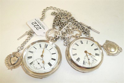 Lot 222 - Two silver open faced pocket watches with a silver chain, white metal chain and two attached silver