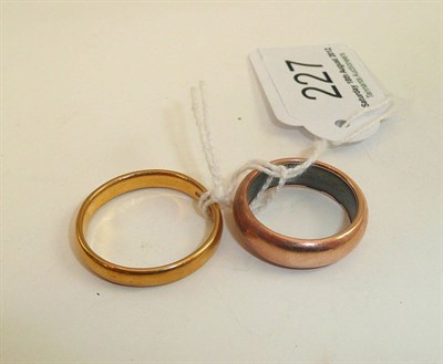 Lot 227 - A 22ct gold band ring and another band ring