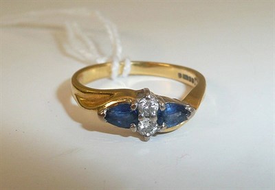 Lot 241 - An 18ct gold diamond and sapphire ring