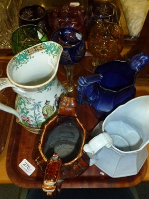 Lot 276 - A set of six hock glasses, four water jugs, decanters, drinking glasses etc on three trays