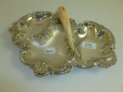 Lot 278 - An early 20th century silver plated three division dish with tusk handle