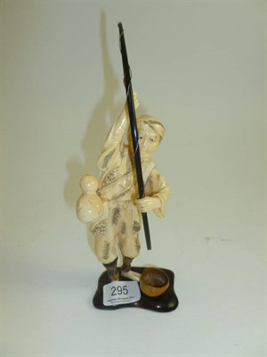 Lot 295 - A Chinese sectional ivory figure of a fisherman with horn rod