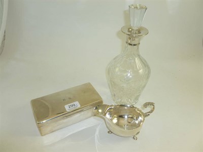 Lot 299 - A silver mounted decanter, a silver cigarette box and a silver cream jug