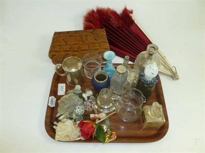 Lot 301 - Tray of assorted glass scent bottles, fan, handbag, silver mug and four small dolls