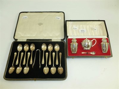 Lot 303 - A cased silver three piece cruet set and a cased set of twelve teaspoons and sugar tongs