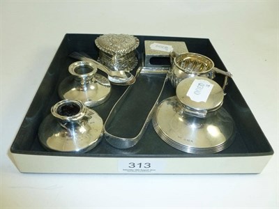 Lot 313 - A small quantity of silver including a silver inkwell, a pair of silver candlesticks, a silver jug