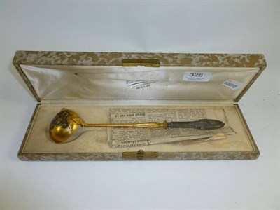 Lot 328 - Continental gilt ladle (cased)