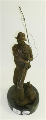 Lot 336 - A bronzed figure of a fisherman