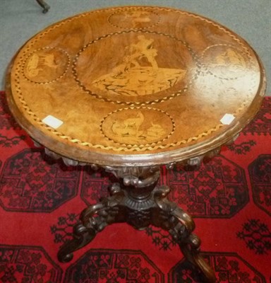 Lot 456 - A carved linden wood tripod table