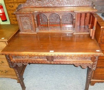 Lot 469 - An Oriental carved hardwood desk