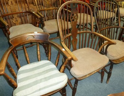 Lot 484 - A wheel back Windsor chair, a spindle back Windsor chair and a captain's chair (3)