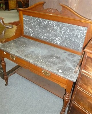 Lot 503 - A late 19th/early 20th century walnut washstand