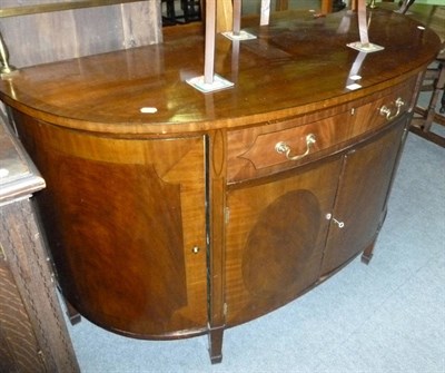 Lot 514 - A reproduction bow fronted sideboard