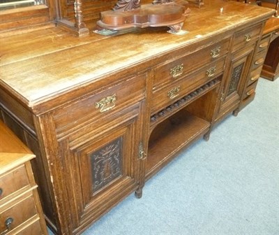 Lot 518 - A late Victorian oak sideboard with mirrored gallery