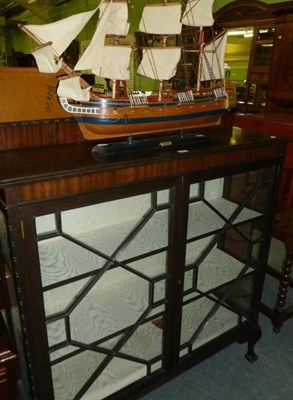 Lot 525 - An early 20th century astragal glazed display cabinet and a model of the galleon HMS Resolution