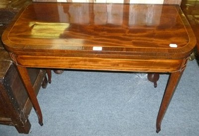 Lot 545 - A mahogany fold over tea table