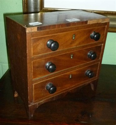 Lot 553 - A 19th century mahogany apprentice piece miniature chest of drawers