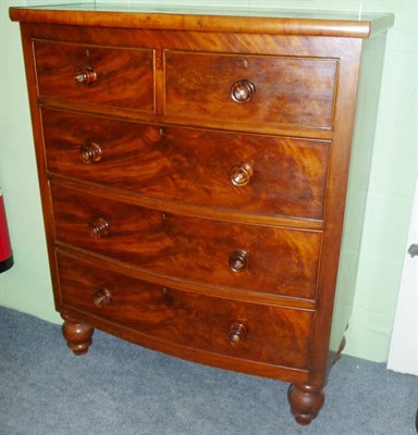 Lot 568 - A Victorian bow front fronted chest of two short over three long drawers