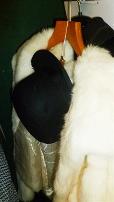 Lot 609 - White evening fur jacket, black wool cape with embroidered detailing and a bowler hat (3)