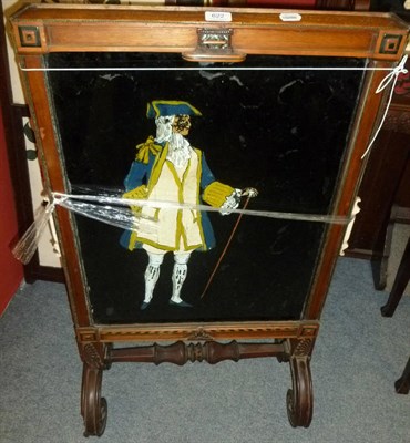 Lot 622 - A three panel glass painted fire screen depicting two men and a lady